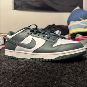 Nike Green and White Athletic Shoes with Classic Design